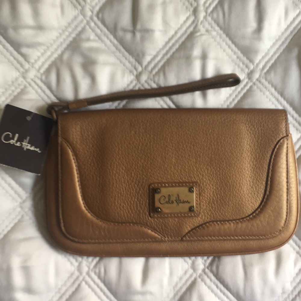 Cole Haan bronze wristlet.